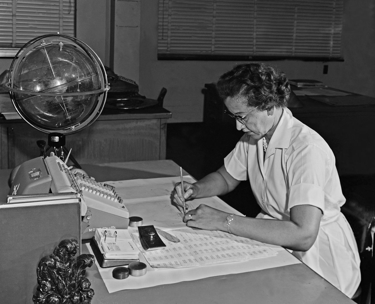 Pioneering mathematician Katherine Johnson poses at her desk at NASA's Langley Research Center in Hampton, Virginia, in 1962. Johnson was part of NASA's "computer pool" — a group of mathematicians whose calculations powered NASA's first successful space missions. Her work, and the work of several other Black female employees, helped launch America's first manned trip to space. Their work was long overlooked until the 2016 novel and movie "Hidden Figures" brought their stories into the spotlight. 