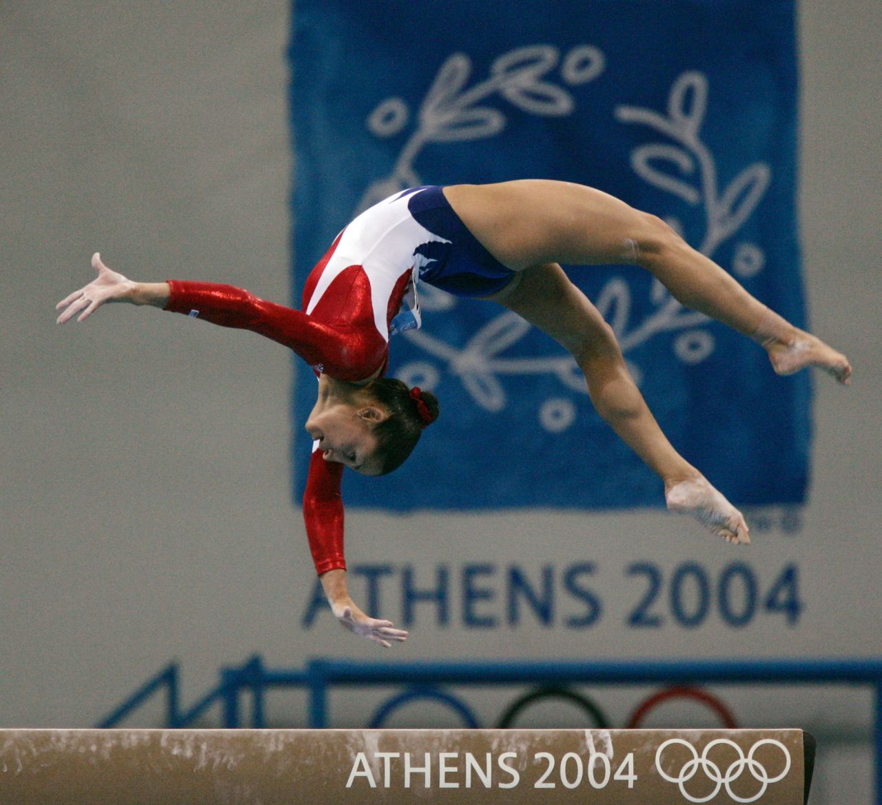 Mohini Bhardwaj performs on the balance beam at the 2004 Olympic Games in Athens, Greece. Bhardwaj defied traditional gymnast stereotypes by competing in the Olympic Games at 25 years old, and she became the first Indian American gymnast to earn an Olympic medal.