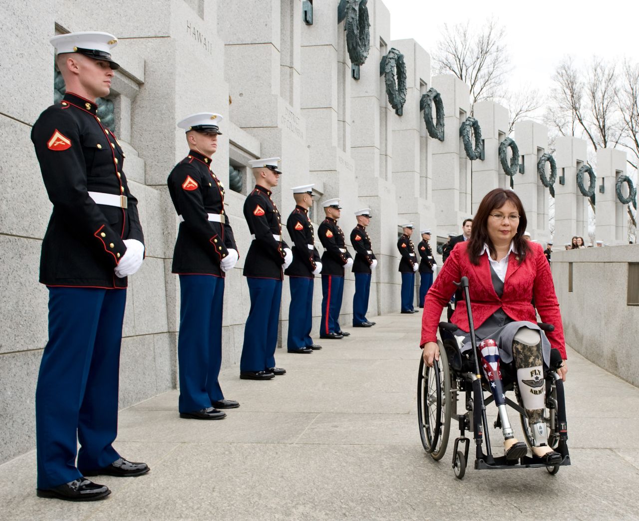 US Sen. Tammy Duckworth arrives at the World War II Memorial in Washington, DC, for a 2010 ceremony honoring World War II veterans who fought in the Pacific. Duckworth, a veteran herself, became a double amputee when her helicopter was shot down in Iraq in 2004. After returning to the United States, Duckworth began her political career as a congresswoman and then later became a senator. In 2018, she became the first US senator to give birth while in office. "Parenthood isn't just a women's issue," she said in a statement announcing the birth of her second daughter. "It's an economic issue and one that affects all parents — men and women alike."
