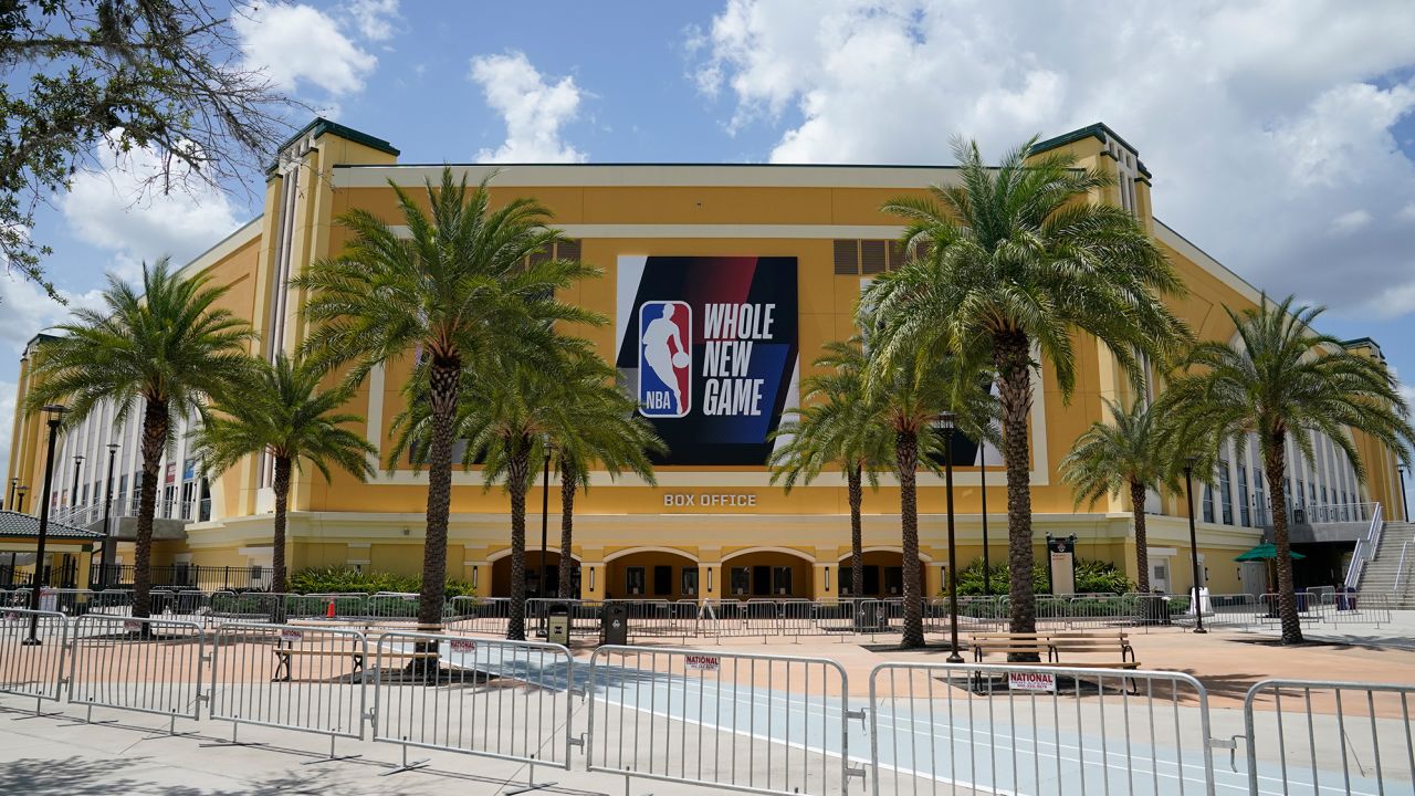 An NBA sign is posted on a basketball arena at ESPN Wide World of Sports Complex Wednesday, July 29, 2020, in Orlando.