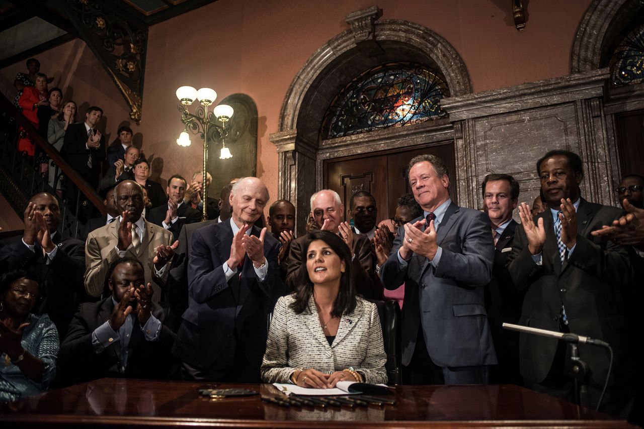 South Carolina Gov. Nikki Haley signs a bill to remove the Confederate flag from the State House grounds in Columbia in 2015. Haley made history in 2011 after she became the first woman and the first person of an ethnic minority to become the governor of South Carolina. She was also the second Indian American governor in US history. 