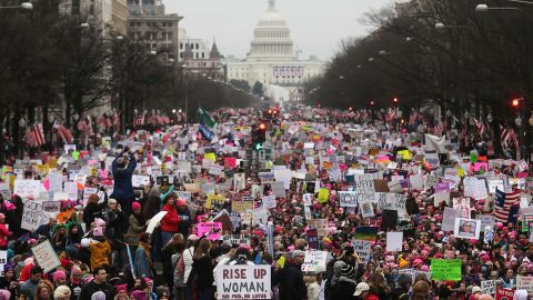 Protesters walk during the Women's March on Washington, with the US Capitol in the background, on January 21, 2017 in Washington, DC. 