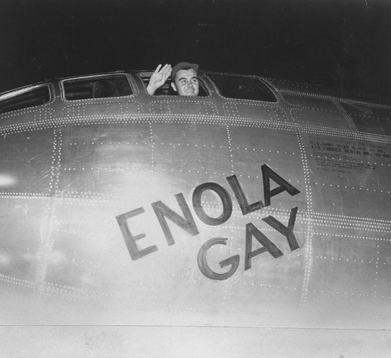 Air Force Col. Paul Tibbetts waves from the pilot's seat of the Enola Gay moments before takeoff on August 6, 1945. A short time later, the plane's crew dropped the first atomic bomb in combat.<br /><br />Eight days earlier, US President Harry Truman had warned Japan that the country would be destroyed if it did not surrender unconditionally.