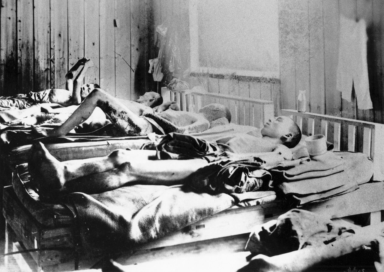 Bomb survivors lie in bed in Hiroshima.