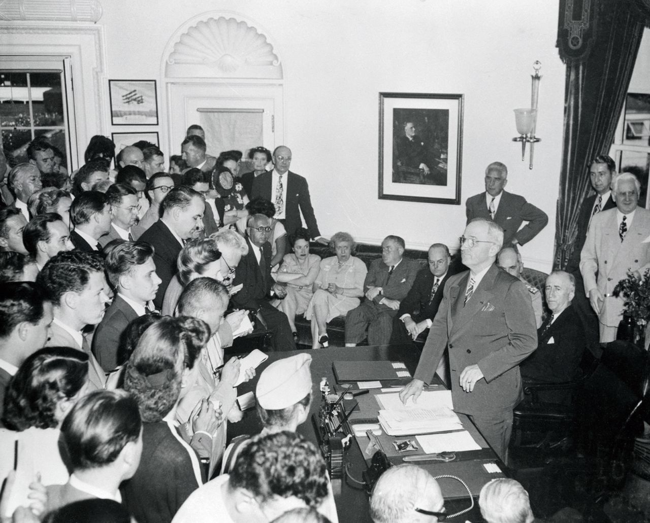 US President Harry Truman announces Japan's surrender to media assembled at the White House.