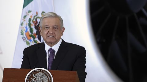 Mexican President Andres Manuel Lopez Obrador speaks during press conference, with the presidential plane in the background on July 27, 2020.