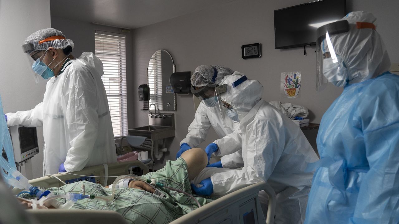 HOUSTON, TX - JULY 28:  (EDITORIAL USE ONLY) Members of the medical staff treat a patient in the COVID-19 intensive care unit at the United Memorial Medical Center on July 28, 2020 in Houston, Texas. COVID-19 cases and hospitalizations have spiked since Texas reopened, pushing intensive-care units to full capacity and sparking concerns about a surge in fatalities as the virus spreads.  (Photo by Go Nakamura/Getty Images)