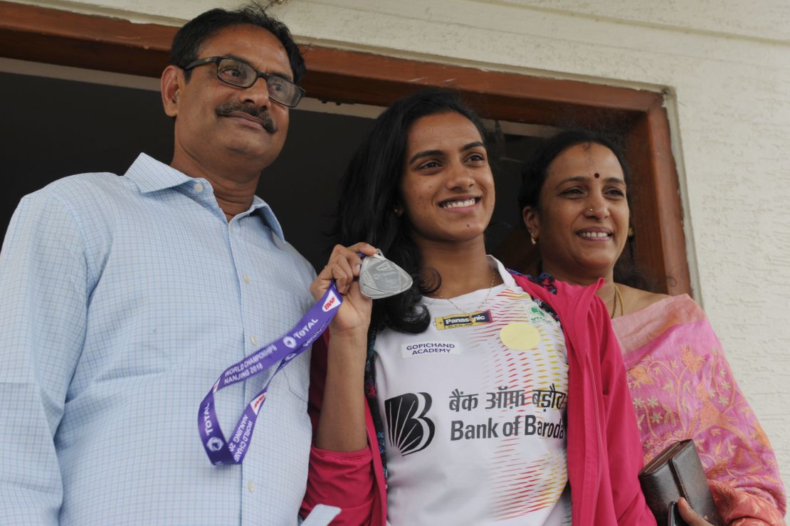 'Your rock and pillars': Sindhu with her father Ramana (L) and mother Vijaya (R) who have played a central role in her upward trajectory