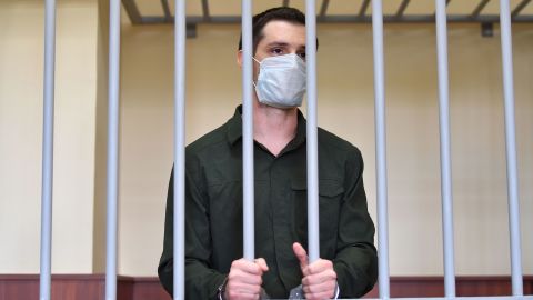 Former Marine Trevor Reed listens from inside a cage during his verdict hearing at Moscow's Golovinsky district court on July 30, 2020.