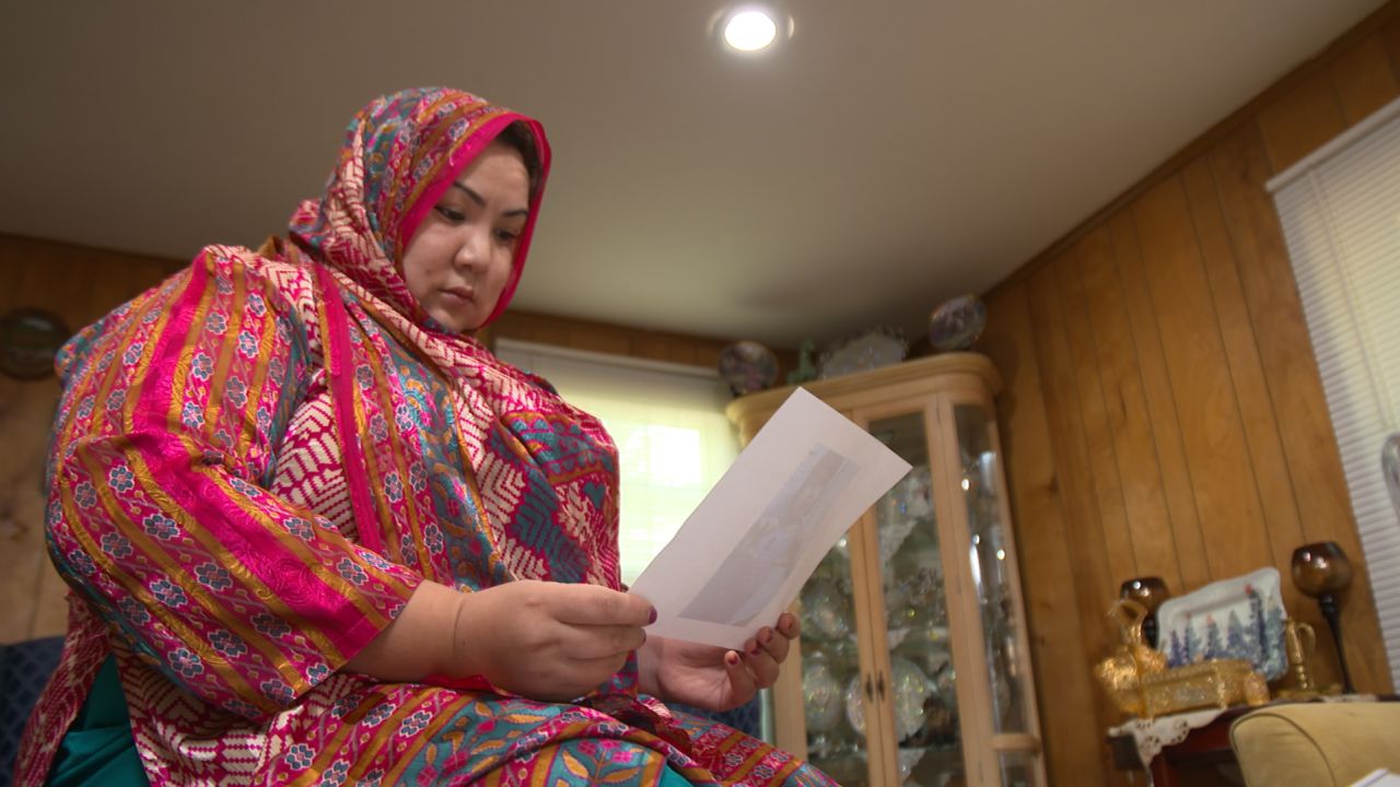 Uyghur exile Zumrat Dawut says her assigned cadre would follow her around the house.