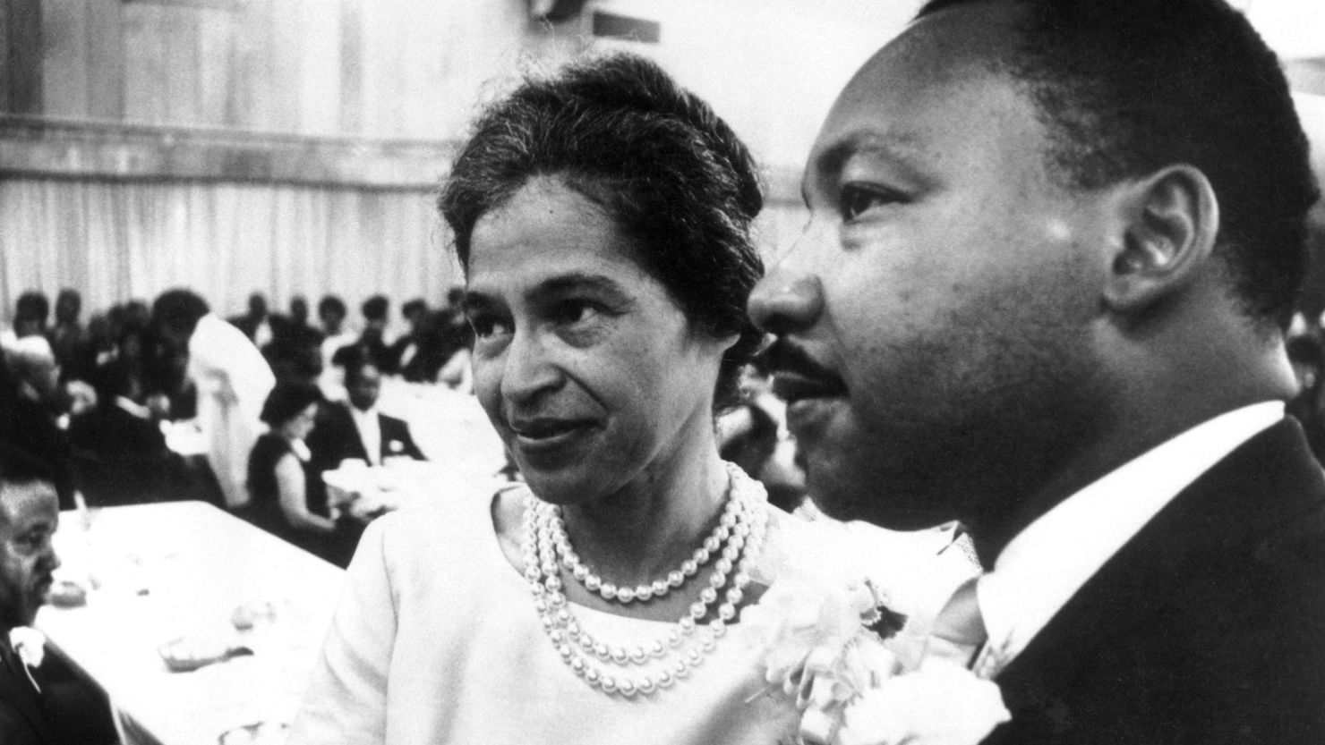 Dr. Martin Luther King Jr. with Rosa Parks at dinner given in her honor during the Southern Christian Leadership Conference.  