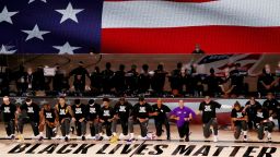 The Los Angeles Lakers and the LA Clippers wear Black Lives Matter Shirt and kneel during the national anthem prior to the game against the LA Clippers at The Arena at ESPN Wide World Of Sports Complex on July 30, 2020 in Lake Buena Vista, Florida. (Photo by Mike Ehrmann/Getty Images)