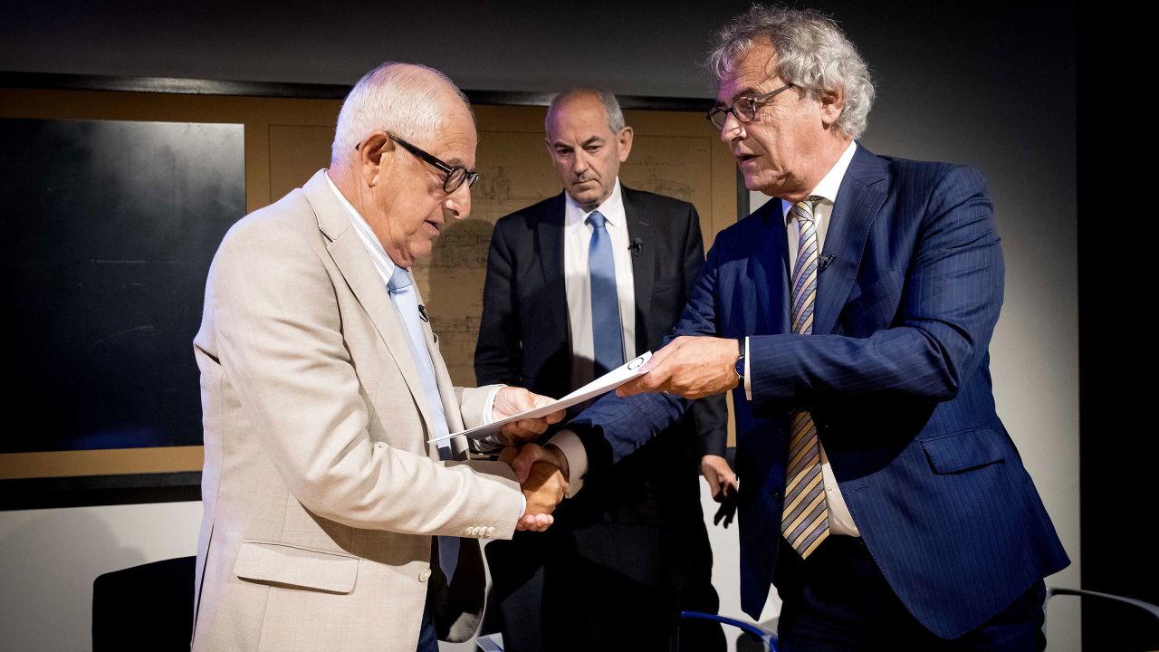 Holocaust victim Salo Muller (L) and president director of Dutch railway company Nederlandse Spoorwegen Roger van Boxtel (R) during a presentation in Utrecht, Netherlands, on June 26, 2019. 