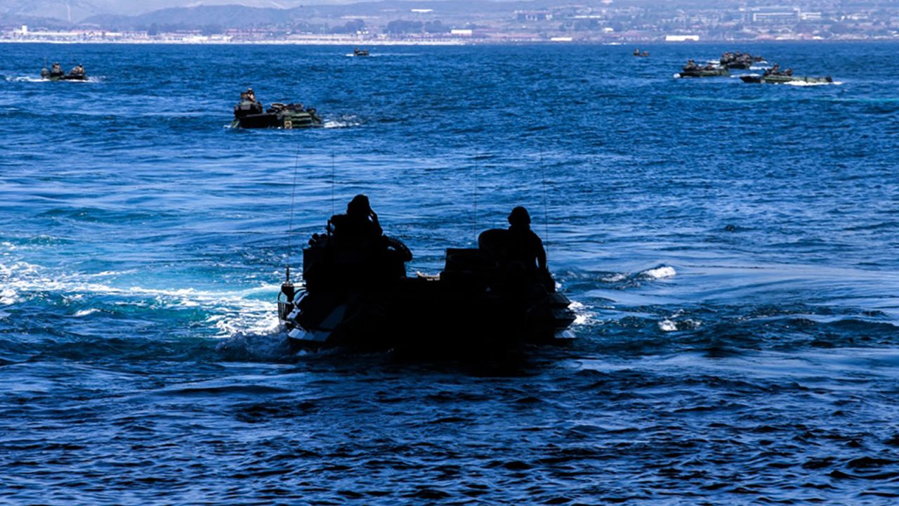  U.S. Marines with Bravo Company, Battalion Landing Team 1/4, 15th Marine Expeditionary Unit, operate assault amphibious vehicles into the well deck of the amphibious landing dock USS Somerset.