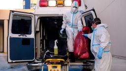 FILE PHOTO: EMTs cleanse their materials outside Memorial West Hospital where coronavirus disease (COVID-19) patients are treated, in Pembroke Pines, Florida, U.S. July 13, 2020. REUTERS/Maria Alejandra Cardona/File Photo