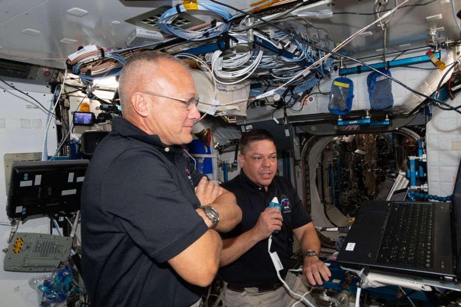 Hurley, left, and Behnken brief mission control on June 1.