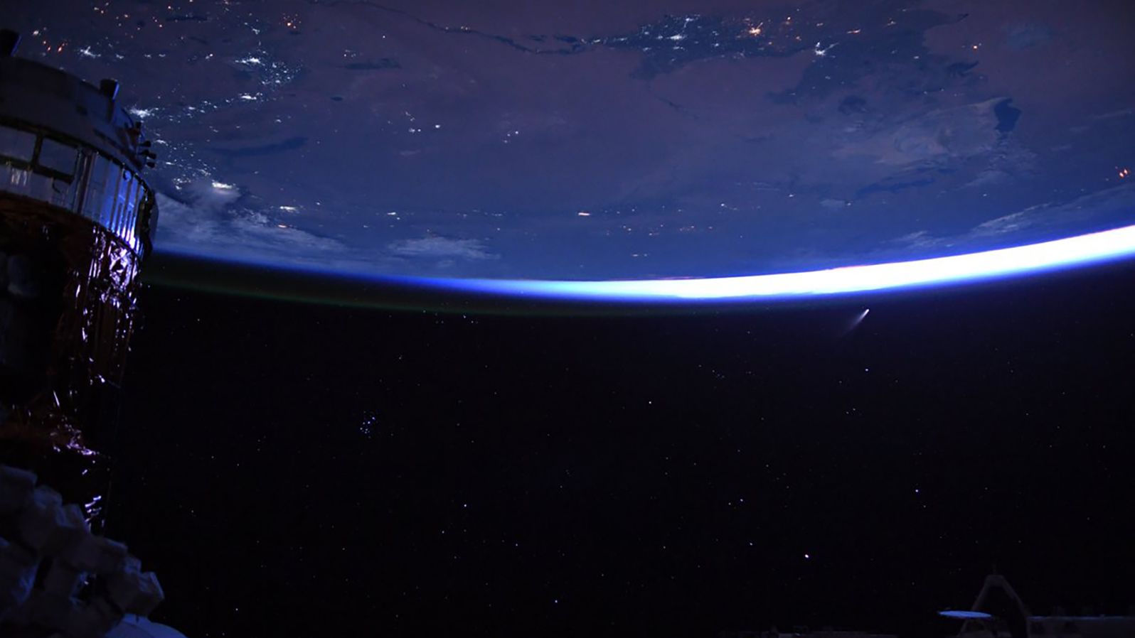 "Night sky, just before dawn from @Space_Station. Stars, cities, spaceships, and a comet!" Behnken wrote on July 9.