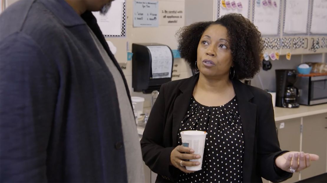 Monique Davis speaks with W. Kamau Bell while filming "United Shades of America" in 2019.