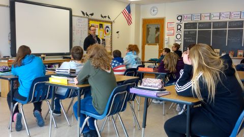 A principal talks to 8th-graders about school safety in Wellsville, New York. Many public schools in the US remain largely segregated.
