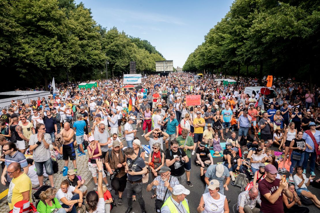 Protesters, mostly unmasked, attend a rally in Berlin against coronavirus restrictions.