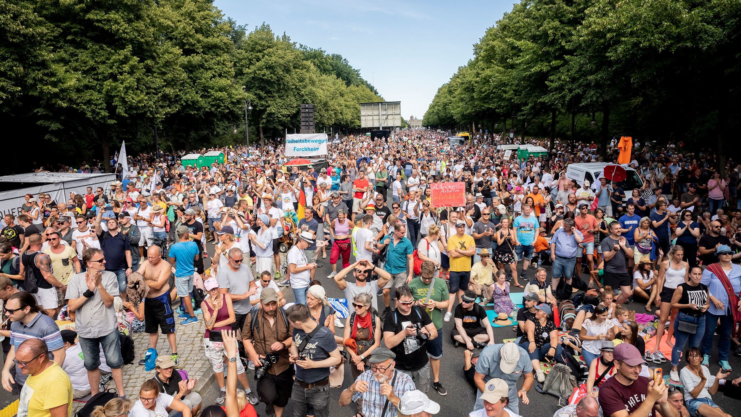 Protesters, mostly unmasked, attend a rally in Berlin against coronavirus restrictions.