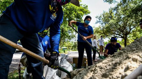 Sandbags are filled for distribution to residents of Palmetto Bay near Miami, Florida, on July 31, 2020.