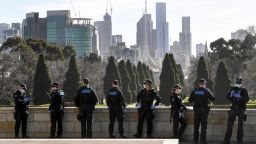 Police patrol The Shrine of Remembrance enforcing the wearing of face masks in Melbourne on July 31, 2020. - As greater Melbourne passed the halfway point of a lockdown initially intended to last six weeks, the state of Victoria - of which Melbourne is the capital - recorded over 600 new cases leaving Premier Daniel Andrews to flag harsher restrictions in a bid to cut the infection rate. (Photo by William WEST / AFP) (Photo by WILLIAM WEST/AFP via Getty Images)