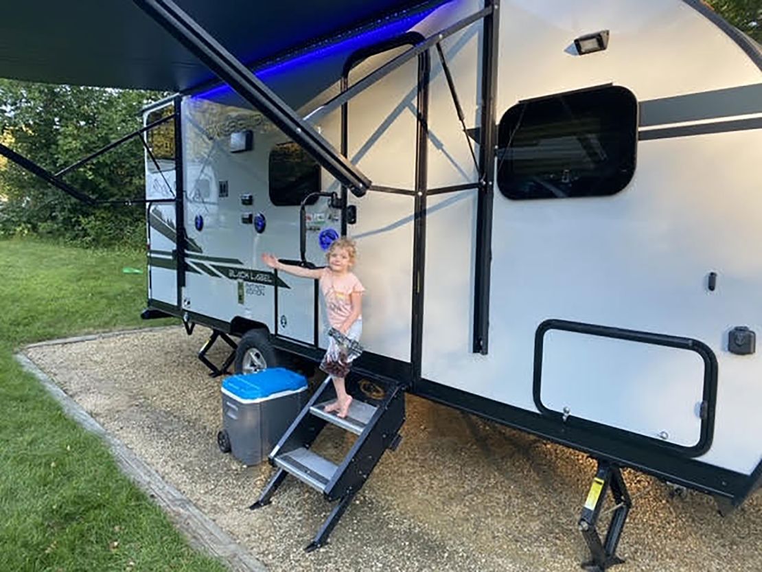 Michaela Sherer's daughter Lennon shows off the new family Wolf Pup trailer.