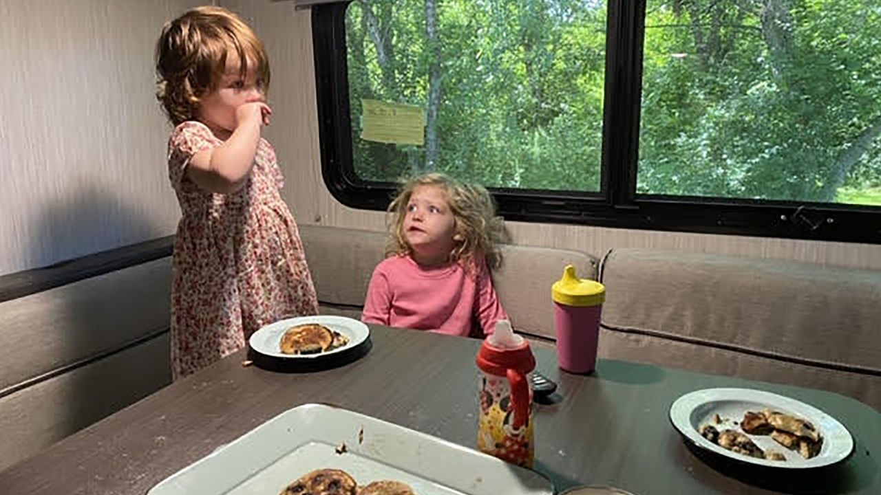 The Sherer children, Hendrix and Lennon, enjoy pancakes inside the family trailer.