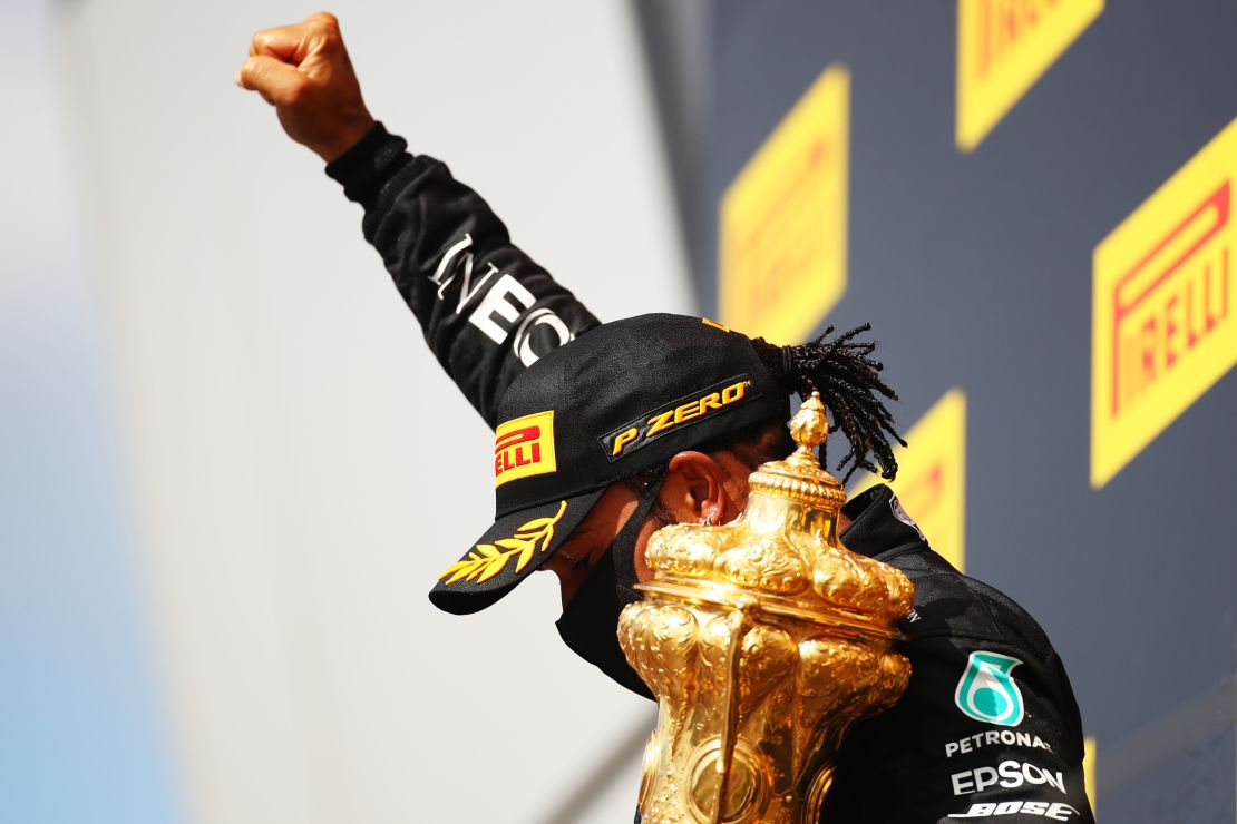 As he has done after previous victories this season, Hamilton raised his fist after collecting the trophy.