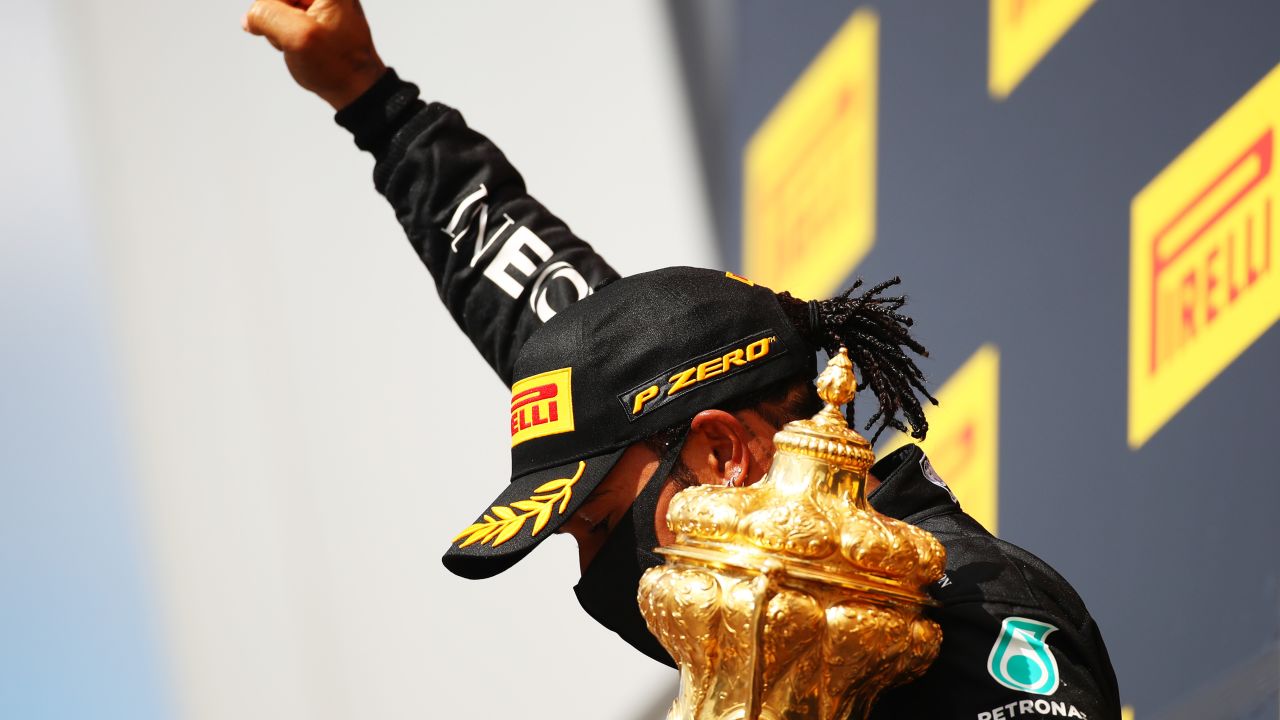 As he has done after previous victories this season, Hamilton raised his fist after collecting the trophy.