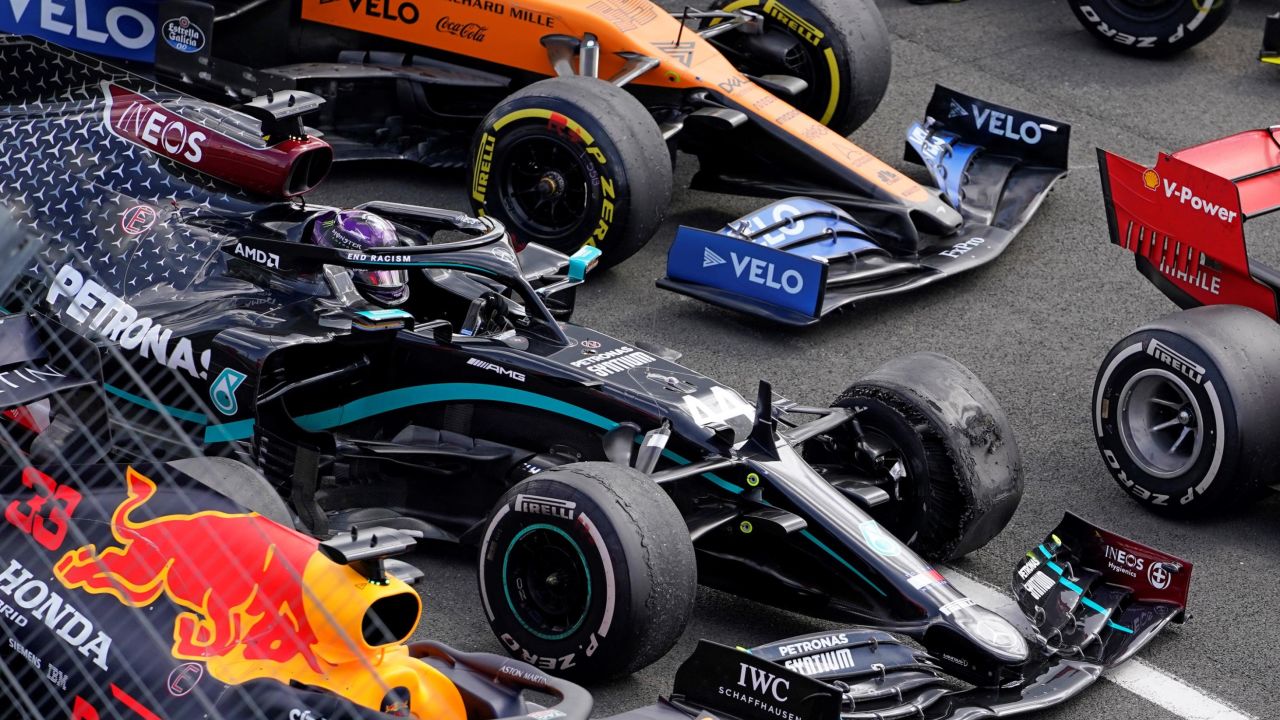 Hamilton survived a late puncture to win at Silverstone.