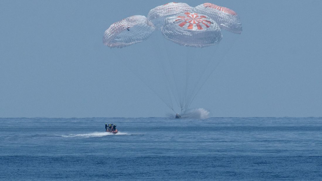 SpaceX's Crew Dragon spacecraft, carrying NASA astronauts Robert Behnken and Douglas Hurley, splashes down into the Gulf of Mexico on Sunday, August 2.