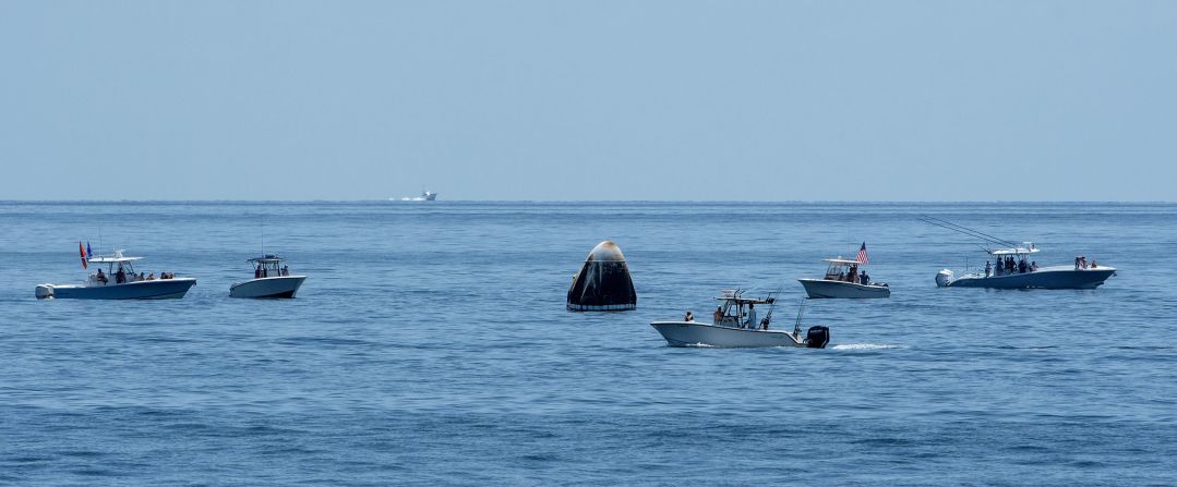 Boats swarm around the Crew Dragon shortly after splashdown. NASA Administrator Jim Bridenstine said during a <a href="https://www.cnn.com/2020/08/02/tech/nasa-spacex-crew-dragon-mission-sunday-scn/index.html" target="_blank">news conference</a> that the Coast Guard was supposed to keep a large swath of ocean around the landing site clear but that some boats made a "beeline" for the capsule. In a statement on August 2, the Coast Guard said, "With limited assets available and with no formal authority to establish zones that would stop boaters from entering the area, numerous boaters ignored the Coast Guard crews' requests and decided to encroach the area, putting themselves and those involved in the operation in potential danger."