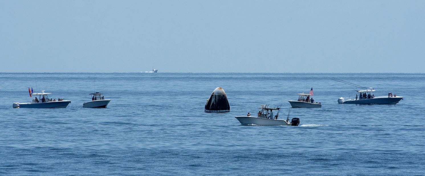 Boats swarm around the Crew Dragon shortly after splashdown. NASA Administrator Jim Bridenstine said during a <a href="https://www.cnn.com/2020/08/02/tech/nasa-spacex-crew-dragon-mission-sunday-scn/index.html" target="_blank">news conference</a> that the Coast Guard was supposed to keep a large swath of ocean around the landing site clear but that some boats made a "beeline" for the capsule. In a statement on August 2, the Coast Guard said, "With limited assets available and with no formal authority to establish zones that would stop boaters from entering the area, numerous boaters ignored the Coast Guard crews' requests and decided to encroach the area, putting themselves and those involved in the operation in potential danger."