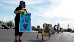 August 1, 2020, El Paso, Texas, United States: ANNA PEREZ, 53, of El Paso, holds a sign as she attends a drive-thru vigil, honoring the 23 victims of the August 3 shooting, at St. Mark‚Äôs Catholic Church in El Paso, Texas. (Credit Image: © Joel Angel Juarez/ZUMA Wire)
