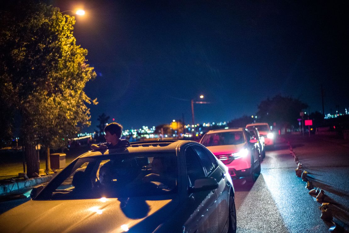 El Pasoans drove through Ascarate Park on Sunday to see a luminarias display honoring the shooting victims.