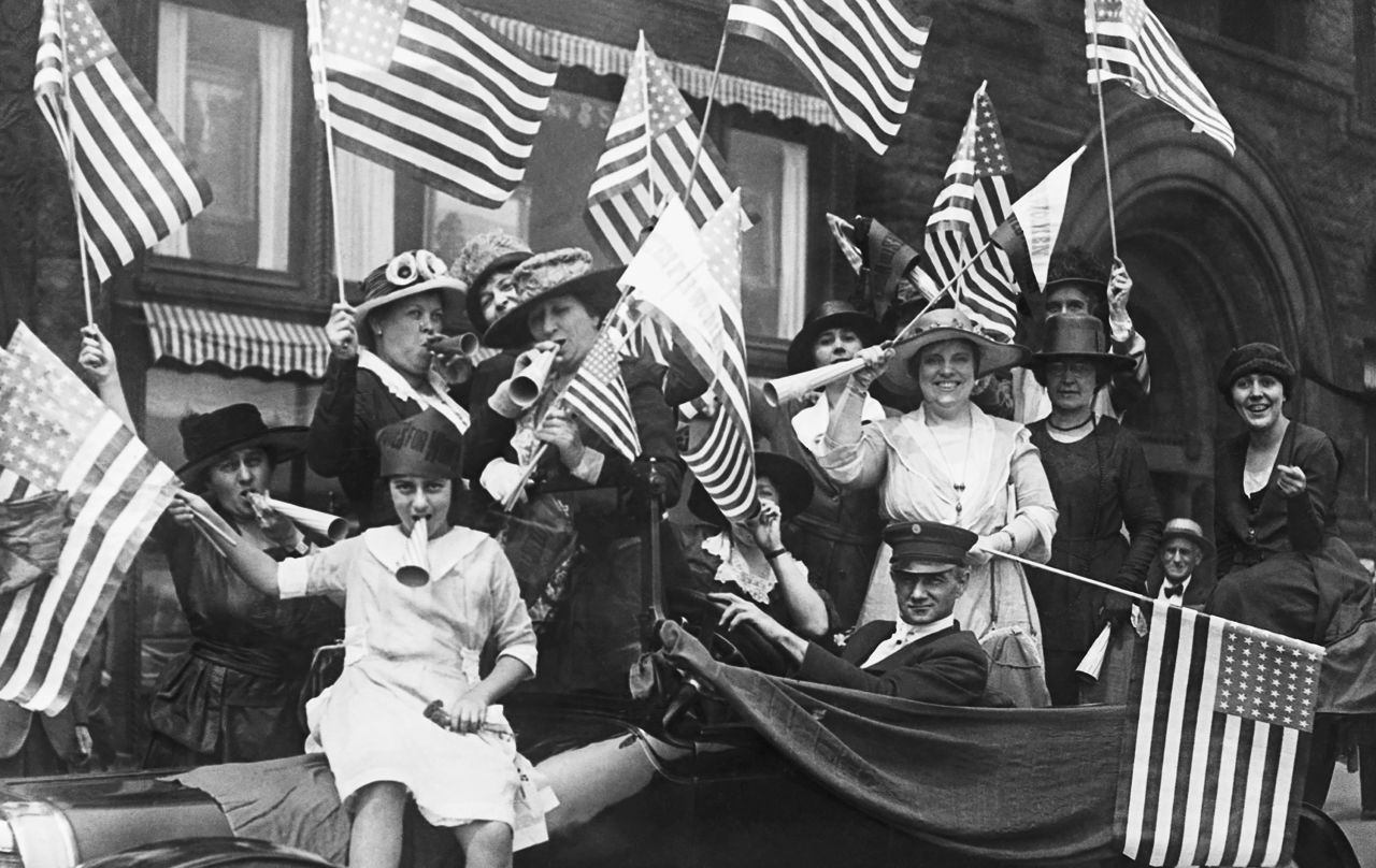 Suffragettes celebrate the passage of the 19th Amendment, which gave American women the right to vote in 1920.