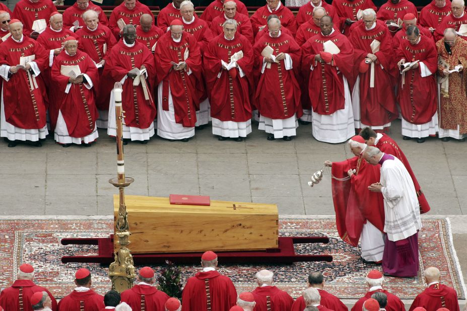 Benedict casts incense over the coffin of Pope John Paul II after his death.