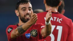Manchester United's Portuguese midfielder Bruno Fernandes celebrates scoring their second goal during the English Premier League football match between Brighton and Hove Albion and Manchester United at the American Express Community Stadium in Brighton, southern England on June 30, 2020. (Photo by Mike Hewitt / POOL / AFP) / RESTRICTED TO EDITORIAL USE. No use with unauthorized audio, video, data, fixture lists, club/league logos or 'live' services. Online in-match use limited to 120 images. An additional 40 images may be used in extra time. No video emulation. Social media in-match use limited to 120 images. An additional 40 images may be used in extra time. No use in betting publications, games or single club/league/player publications. /  (Photo by MIKE HEWITT/POOL/AFP via Getty Images)