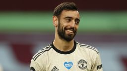 Manchester United's Portuguese midfielder Bruno Fernandes grins during the English Premier League football match between Aston Villa and Manchester United at Villa Park in Birmingham, central England on July 9, 2020. (Photo by ANDREW BOYERS / POOL / AFP) / RESTRICTED TO EDITORIAL USE. No use with unauthorized audio, video, data, fixture lists, club/league logos or 'live' services. Online in-match use limited to 120 images. An additional 40 images may be used in extra time. No video emulation. Social media in-match use limited to 120 images. An additional 40 images may be used in extra time. No use in betting publications, games or single club/league/player publications. /  (Photo by ANDREW BOYERS/POOL/AFP via Getty Images)