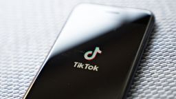 Signage for ByteDance Ltd.'s TikTok app is displayed on a smartphone in an arranged photograph taken in Arlington, Virginia, U.S., on Monday, Aug. 3, 2020. In a bid to salvage a deal for the U.S. operations of TikTok, Microsoft Corp. Chief Executive Officer Satya Nadella spoke with President Donald Trump by phone about how to secure the administrations blessing to buy the wildly popular, but besieged, music video app. Photographer: Andrew Harrer/Bloomberg via Getty Images