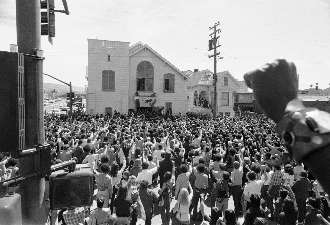 About 1,500 mourners give the Black Panther salute as the body of "Soledad Brother" George Jackson was carried from St. Augustine's Episcopal Church in Oakland, California, in 1971. 