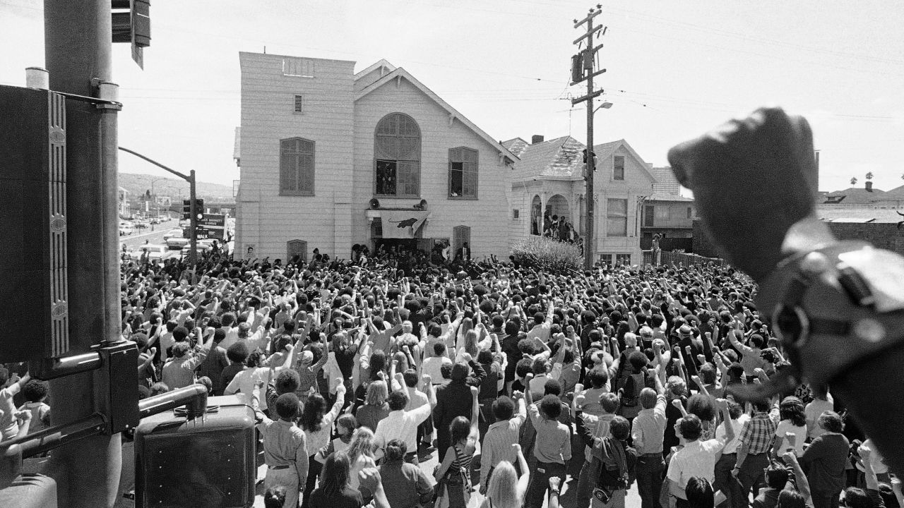 About 1,500 mourners give the Black Panther salute as the body of "Soledad Brother" George Jackson was carried from St. Augustine's Episcopal Church in Oakland, California, in 1971.
