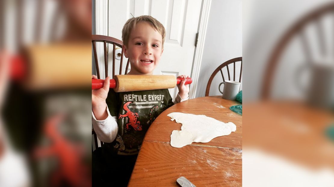 Garrett makes dumplings as part of meals given to those in need.