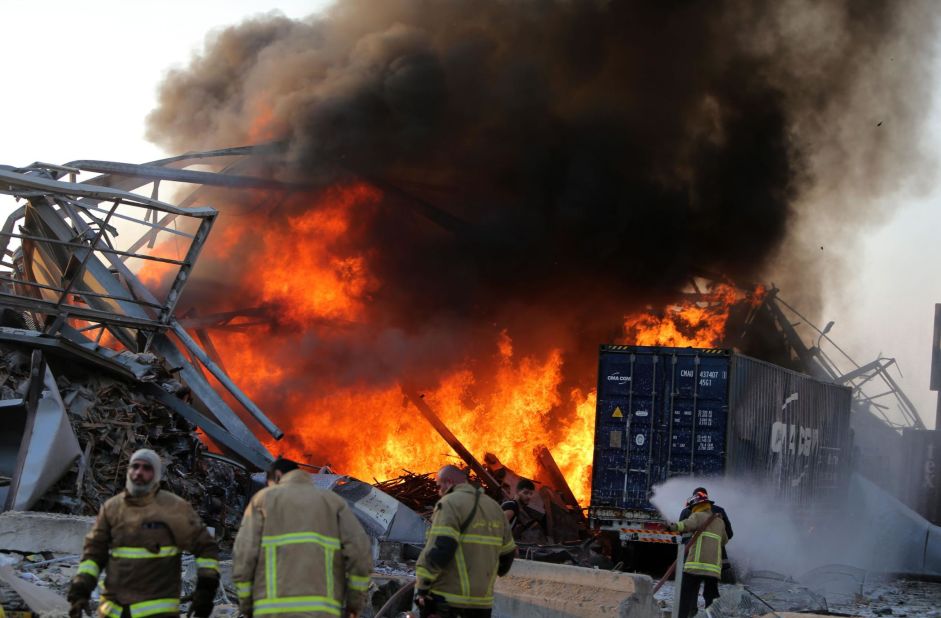 Firefighters work at the scene after the explosion.