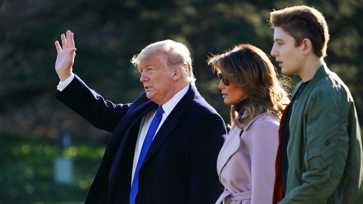 US President Donald Trump, First Lady Melania Trump and son Barron Trump make their way to board Marine One from the South Lawn of the White House in Washington, DC on January 17, 2020. 