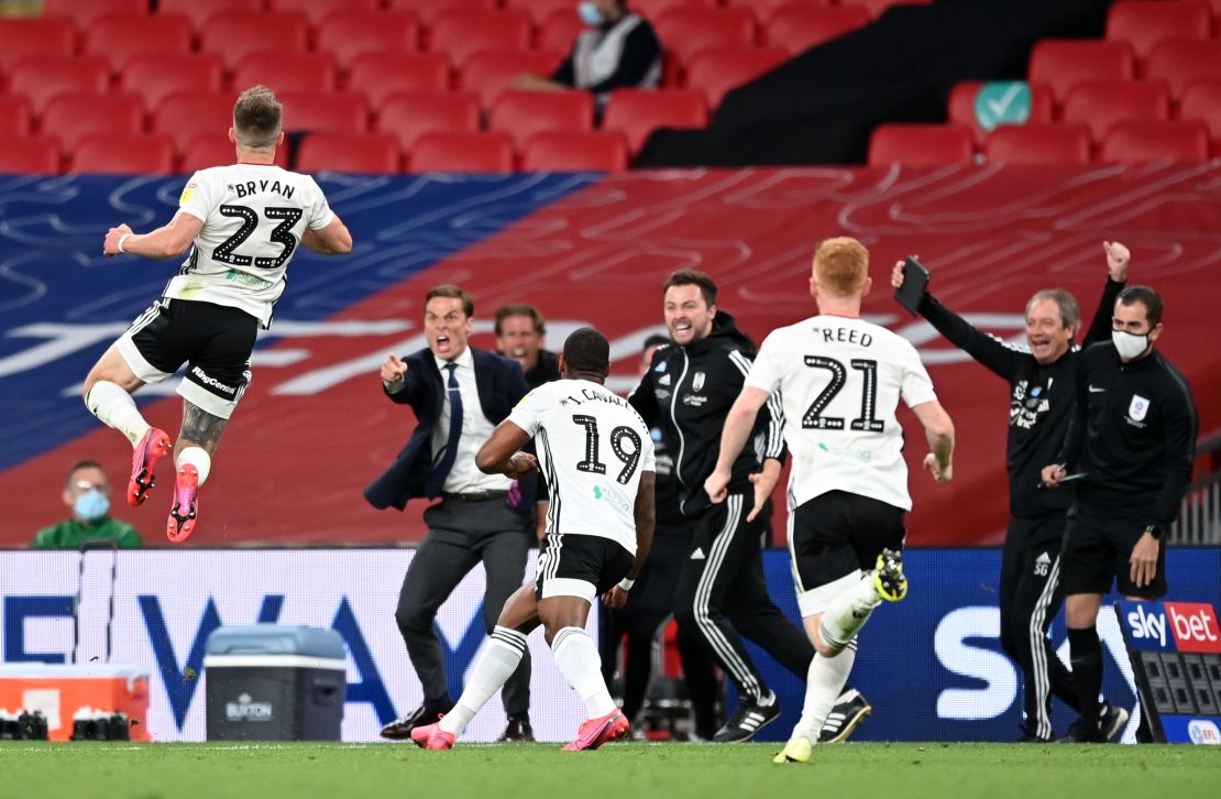 Joe Bryan celebrates after scoring Fulham's first goal.