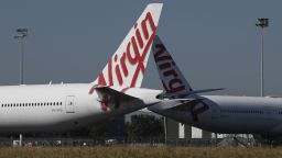 Virgin Australia wide-body aircrafts are seen parked in the Brisbane Airport on August 05, 2020 in Brisbane, Australia. Virgin Australia has announced 3000 job cuts as part of a radical cost reduction strategy for the airline, while its discount provider Tiger Air will close. (Photo by Albert Perez/Getty Images)