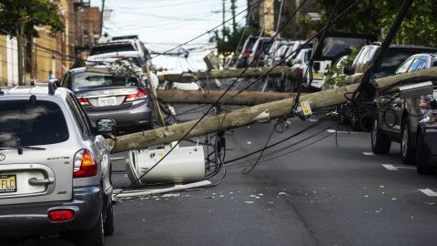 Utility poles were felled Tuesday by Tropical Storm Isaias as it hit Guttenberg, New Jersey.